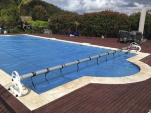 Solar blanket & C-Frame roller with casters on massive pool