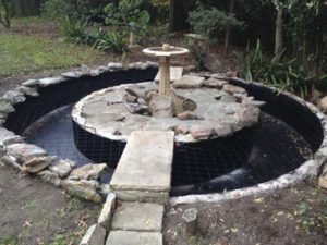 Net fitted to renovated garden fountain