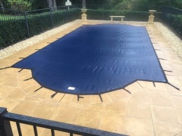 does a heated pool need a cover