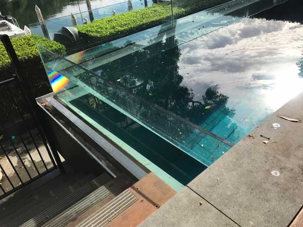 complex glass wall pool requires winter leaf cover