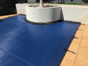 Custom-designed pool covers seamlessly integrated with feature or retaining walls in Perth, ensuring safety and aesthetics.