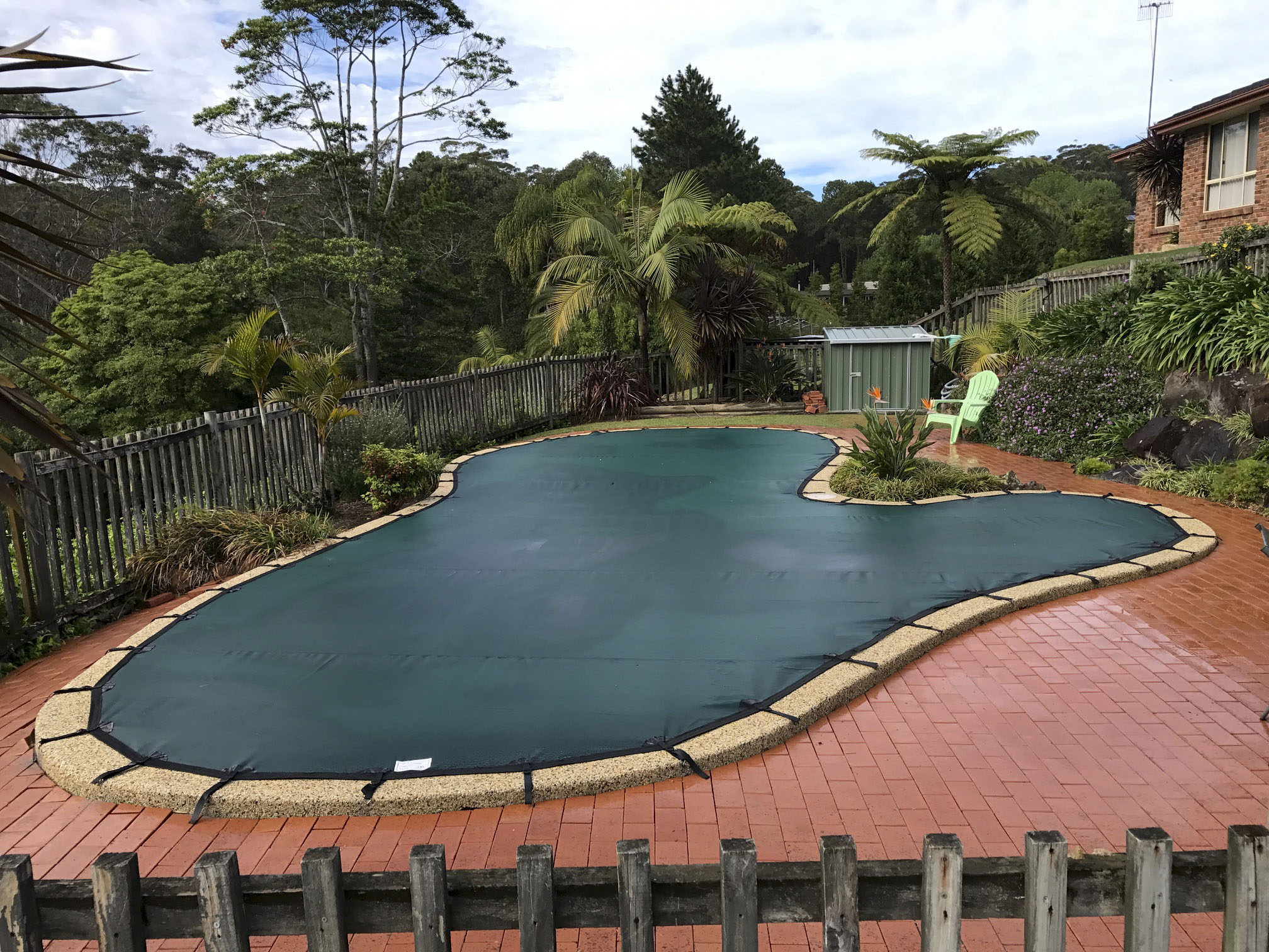 Custom Odd Shaped Pool Cover in Perth safeguarding a uniquely contoured swimming pool.